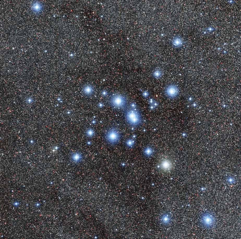 The colored image shows a white-blue star cluster against the background of the black universe.